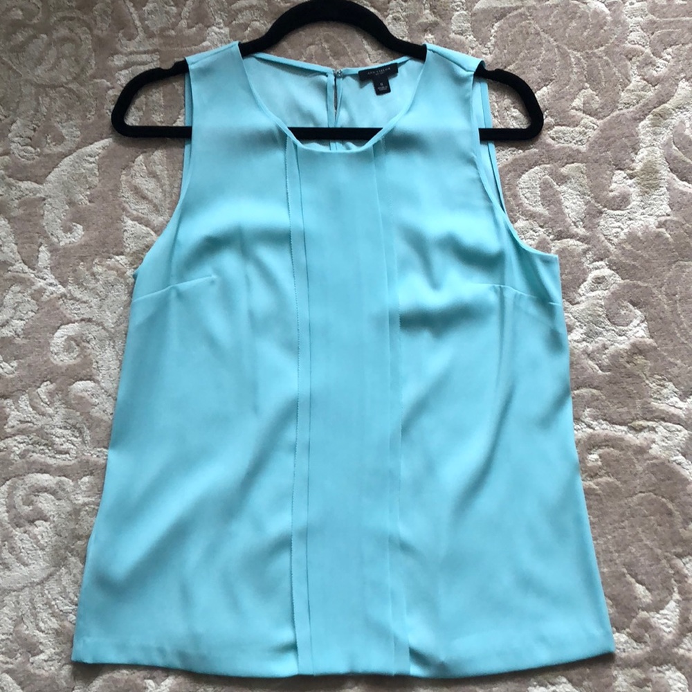 Baby blue sleeveless pleated blouse
